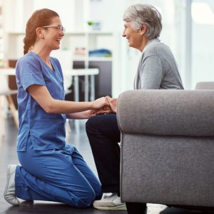 Female doctor talking with her patient