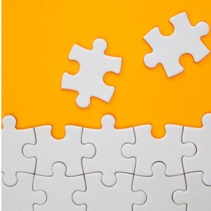 Yellow background with white puzzle pieces