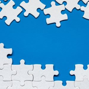 Blue background with white puzzle pieces