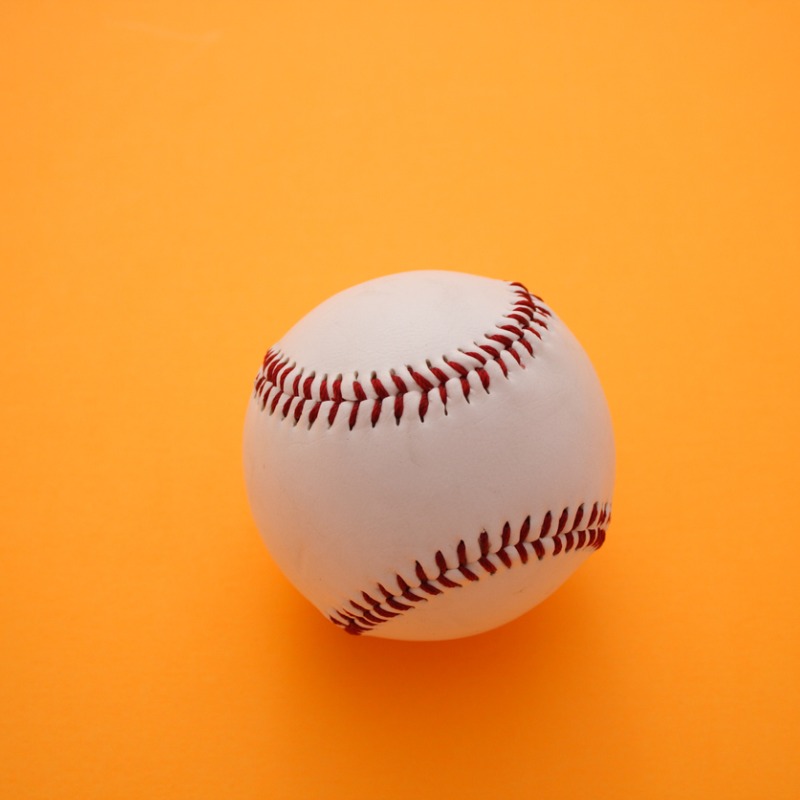 Baseball on orange background
